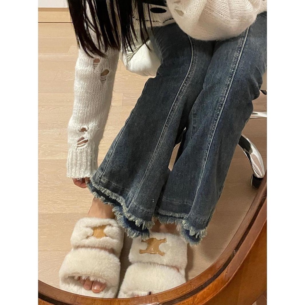 Quần jean lưng cao ống loe phối tua rua