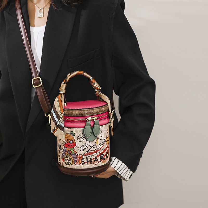 Túi Đeo Chéo Hình Trụ Họa Tiết Graffiti Thời Trang Dành Cho Nữ