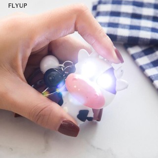 Móc khóa hình bò sữa có đèn led và âm thanh vui nhộn cho bé