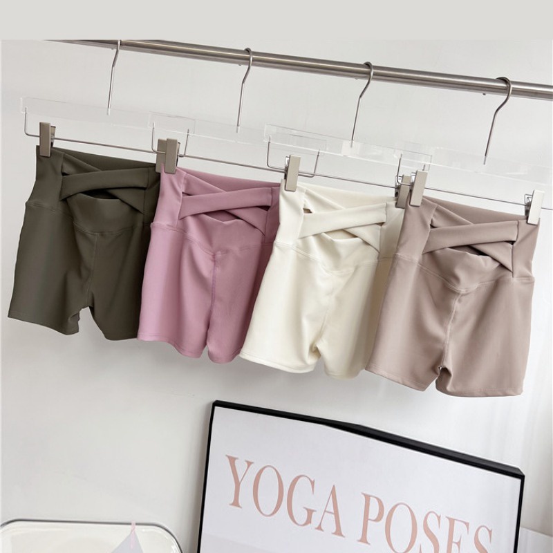 Quần short thể thao lưng chéo eo cao thắt lưng mật ong peach hip lift nhanh khô quần ba bên chạy