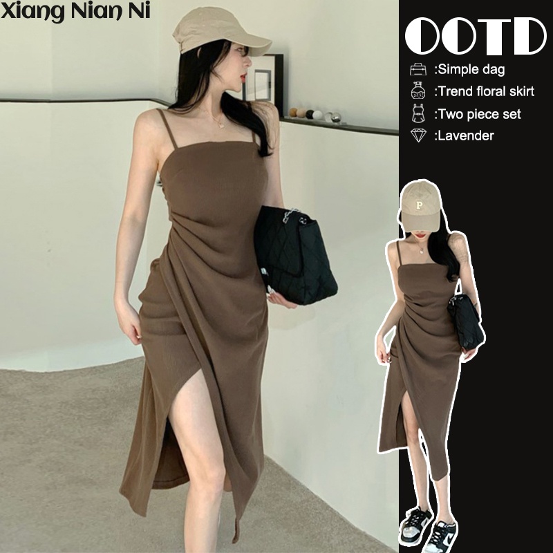 Đầm hai dây Xiang Nian Ni dáng dài ôm eo xẻ tà kiểu cách cá tính