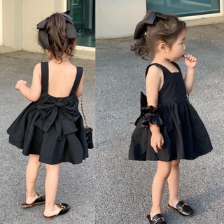 Váy đen đính nơ hở lưng, tặng buộc tóc siêu xinh cho bé 8-30kg