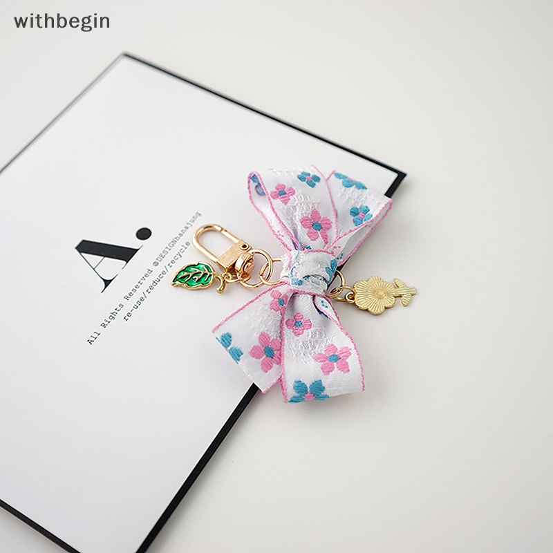 1 Móc Khóa Hình Hoa Hướng Dương Thắt Nơ Ruy Băng Nhỏ Xinh