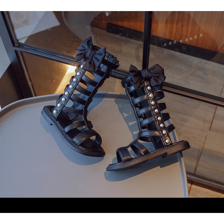 Xăng đan Chiến Binh La Mã Cổ Cao Đính Nơ Và Ngọc Trai Thời Trang Mùa Hè 2023 Cho Bé Gái