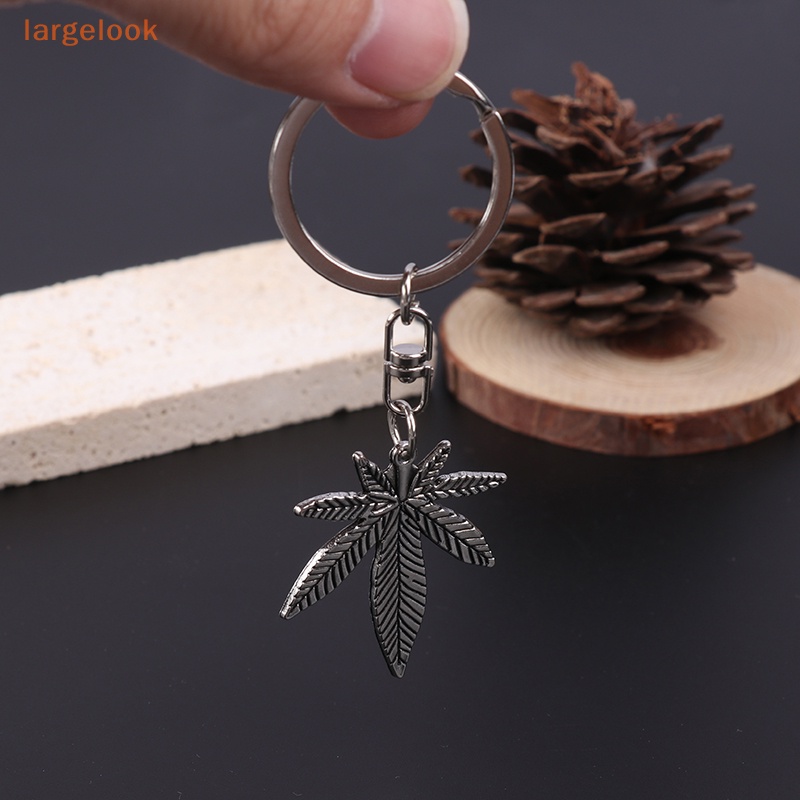 Móc Khóa Kim Loại Hình Lá Phong Màu Bạc Thời Trang