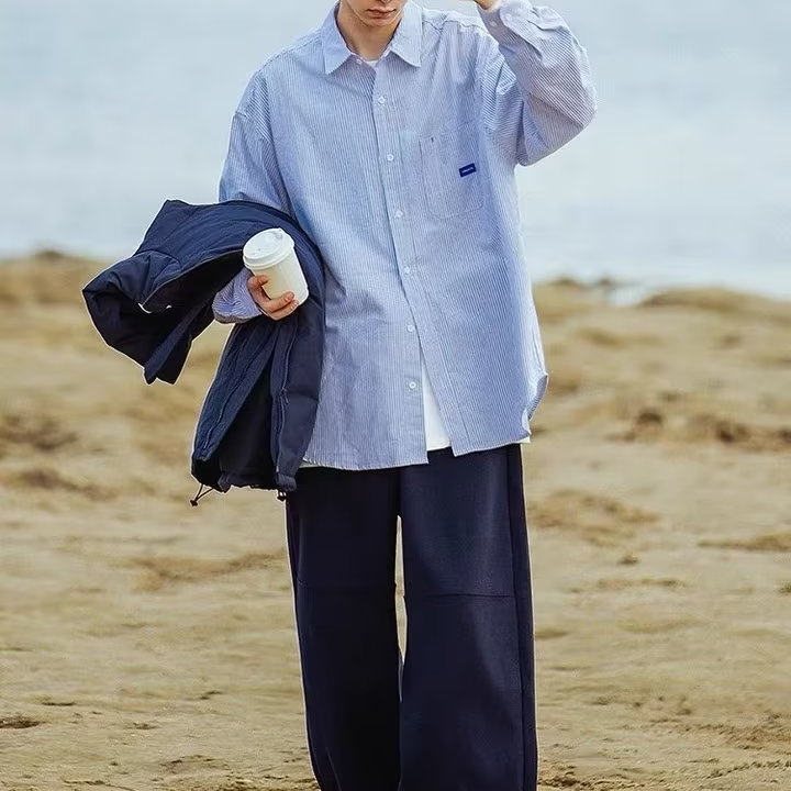 Áo Sơ Mi Nữ Dài Tay Sọc Dọc Màu Xanh Dương Nhạt Phong Cách Mới