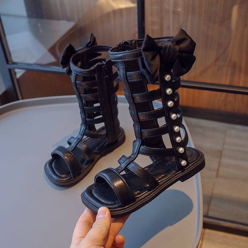 Xăng đan Chiến Binh La Mã Cổ Cao Đính Nơ Và Ngọc Trai Thời Trang Mùa Hè 2023 Cho Bé Gái
