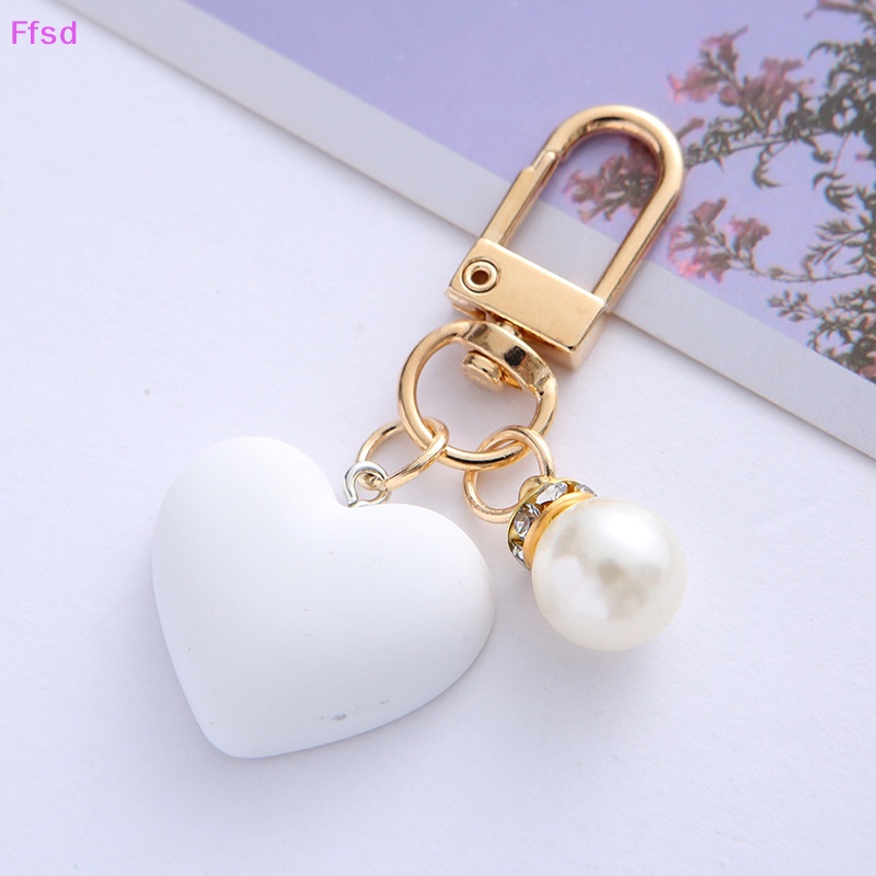 {Ffsd} Móc Khóa Hình Trái Tim Mặt Nhám Trắng Đen Với Túi Đựng Tai Nghe Ngọc Trai Ch Làm Quà Tặng Tình Bạn * Hàng Bán Chạy