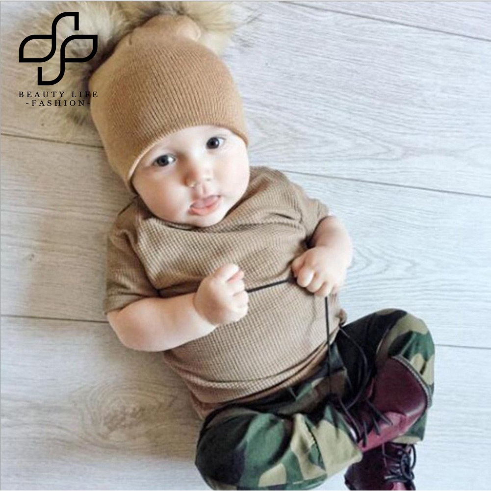 Nón Len Ấm Áp Màu Trơn Đính Hai Quả Bông Thời Trang Thu Đông Cho Bé