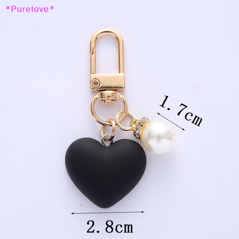 Purelove &gt; Móc Khóa Hình Trái Tim Mặt Nhám Màu Trắng Đen Đính Ngọc Trai Thời Thượng Kèm Túi Đựng Tai Nghe Cho Cặp Đôi /