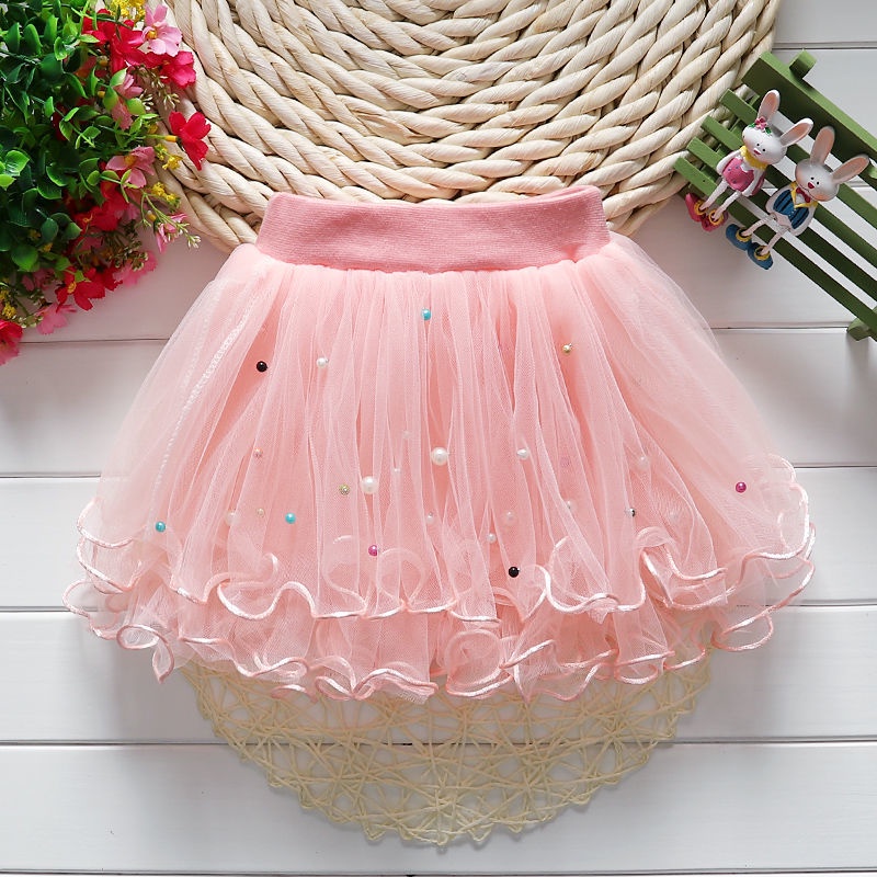 Váy lưới puffy váy xếp ly màu rắn của cô gái