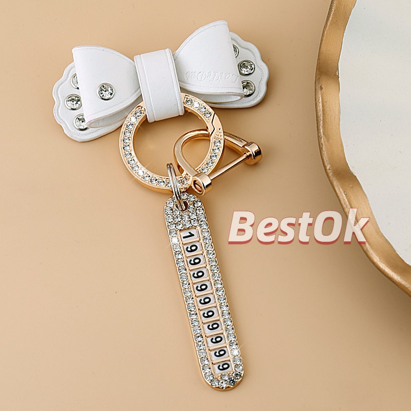 Móc Khóa Da Đính Đá Kim Loại Màu Vàng Hình Nơ Dễ Thương Có Biển Số Cho Nam Và Nữ