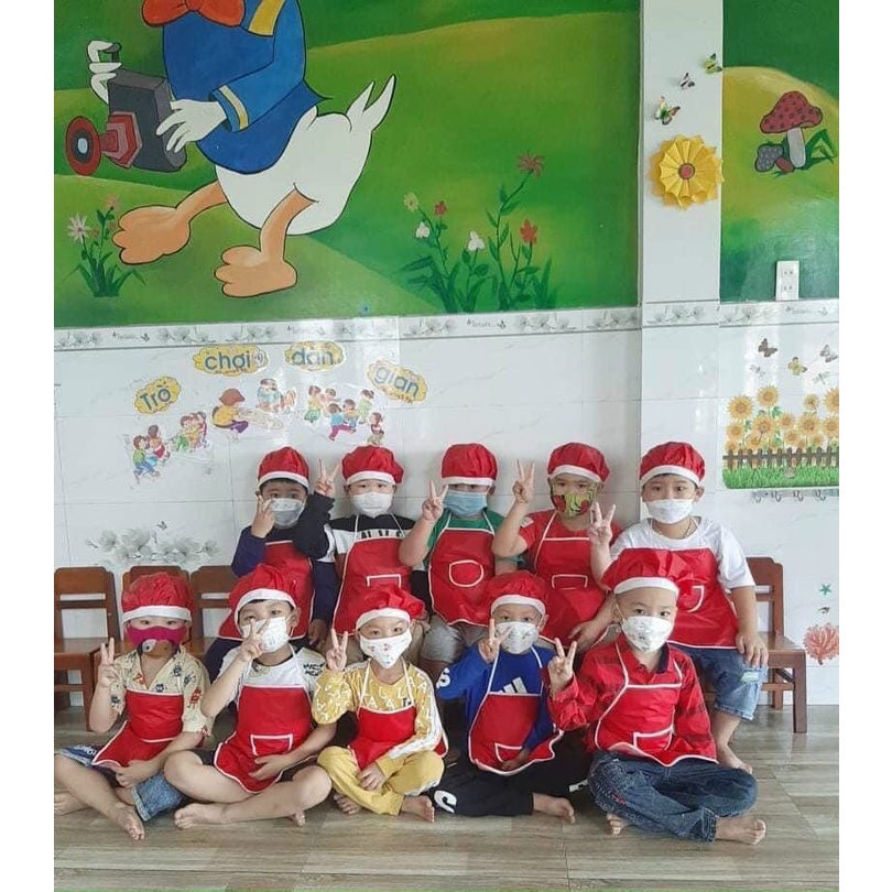 Tạp dề và mũ cho bé có 7 màu chất liệu 2 lớp kèm mũ