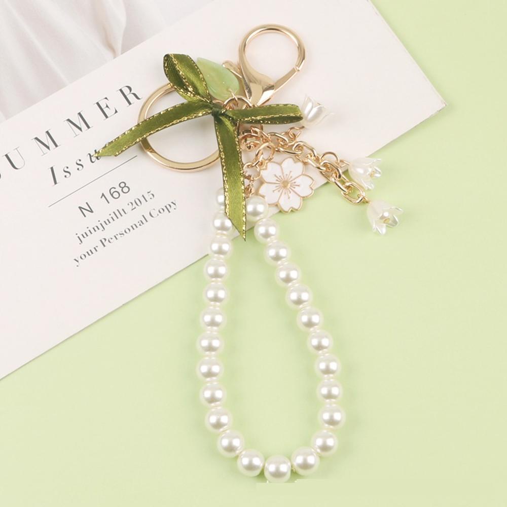 Ốp Điện Thoại Hình Hoa Lily Đính Ngọc Trai Kèm Móc Khóa Độc Đáo Trang Trí Túi Xách