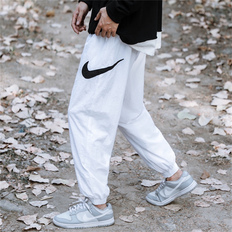 Quần Dài Thể Thao Thêu Logo Nyke 100% Chính Hãng Chất Liệu Nylon Co Giãn Thời Trang Cho Nam Và Nữ