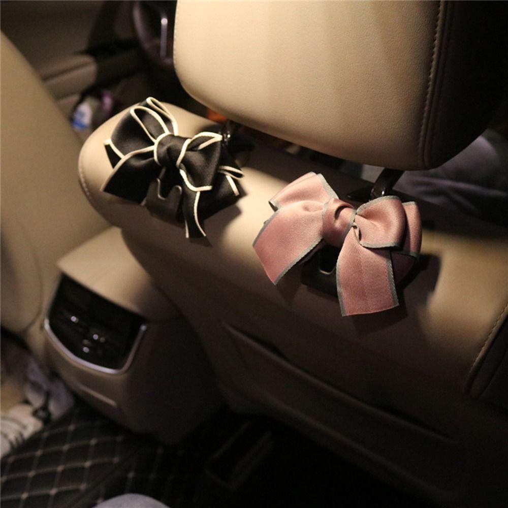 Móc Treo Đồ Gắn Lưng Ghế Xe Hơi Hình Nơ Bằng Nhựa Đa Năng Tiện Dụng