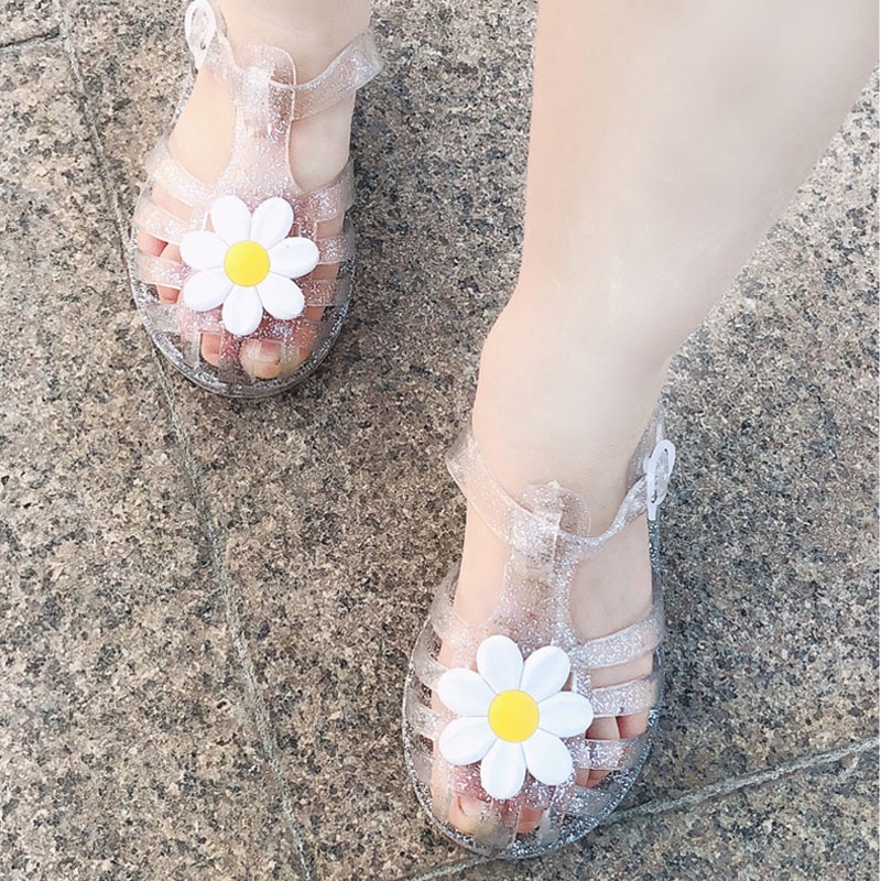 Giày sandal JOYNCLEON bằng nhựa dẻo trong suốt đính hoa dễ thương phong cách La Mã cho bé