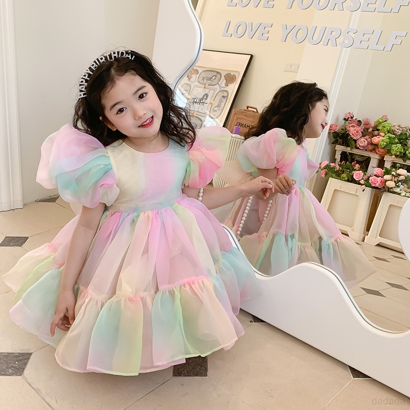 Đầm Công Chúa Phối Lưới Tay Phồng Đính Nơ Màu Cầu Vồng Thời Trang Mùa Hè Cho Bé Gái