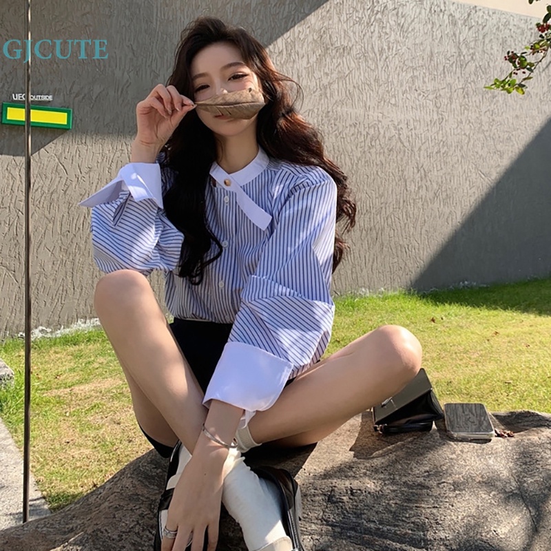 Gjocute Áo Sơ Mi Kẻ Sọc Xanh Lam Sang Trọng Tay Loe Phối Nút Thời Trang Mùa Xuân Cho Nữ WTD