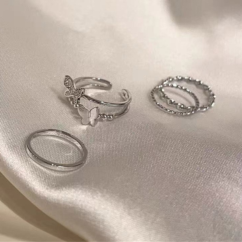 Set 4 Nhẫn Đeo Ngón Trỏ Bằng Kim Loại Hình Bướm Thời Trang Cho Nữ