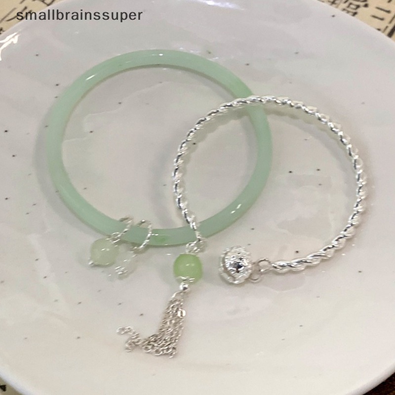 Vòng Đeo Tay Dạng Hở Phối Tua Rua Màu Xanh Lá Phong Cách Vintage Thời Trang Cho Nữ SBS