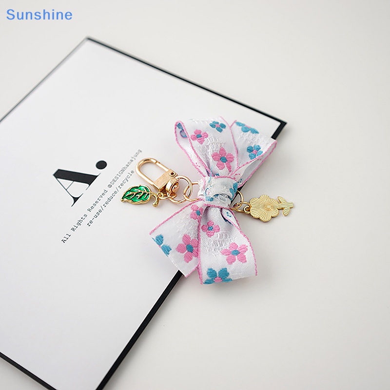 1 Móc Khóa Hình Hoa Hướng Dương Thắt Nơ Ruy Băng Đáng Yêu