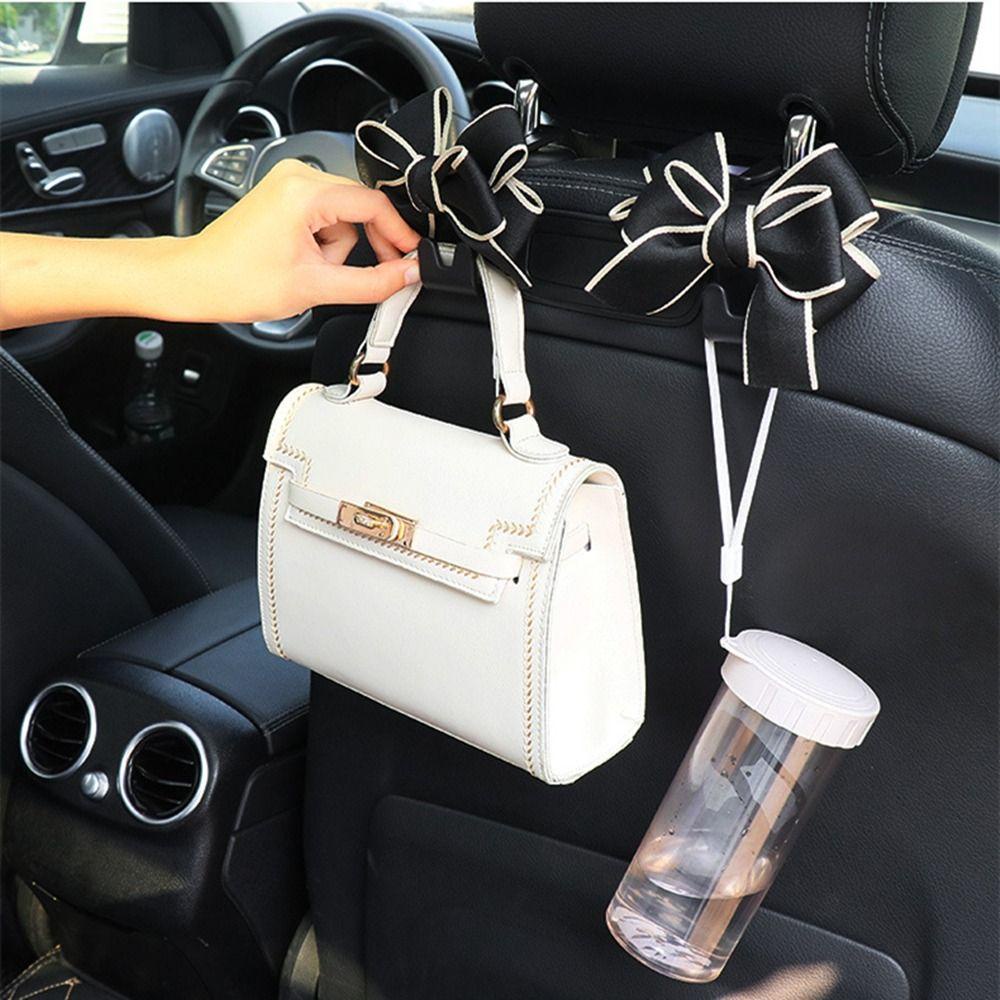 Móc Treo Đồ Gắn Lưng Ghế Xe Hơi Hình Nơ Bằng Nhựa Đa Năng Tiện Dụng