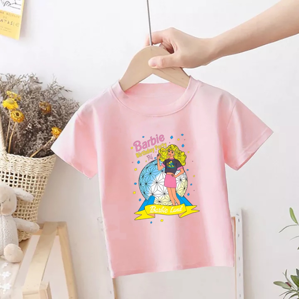 Áo Thun Tay Ngắn In Hình Búp Bê barbie Màu Hồng Thời Trang Cho Bé Gái Từ 1-12 Tuổi