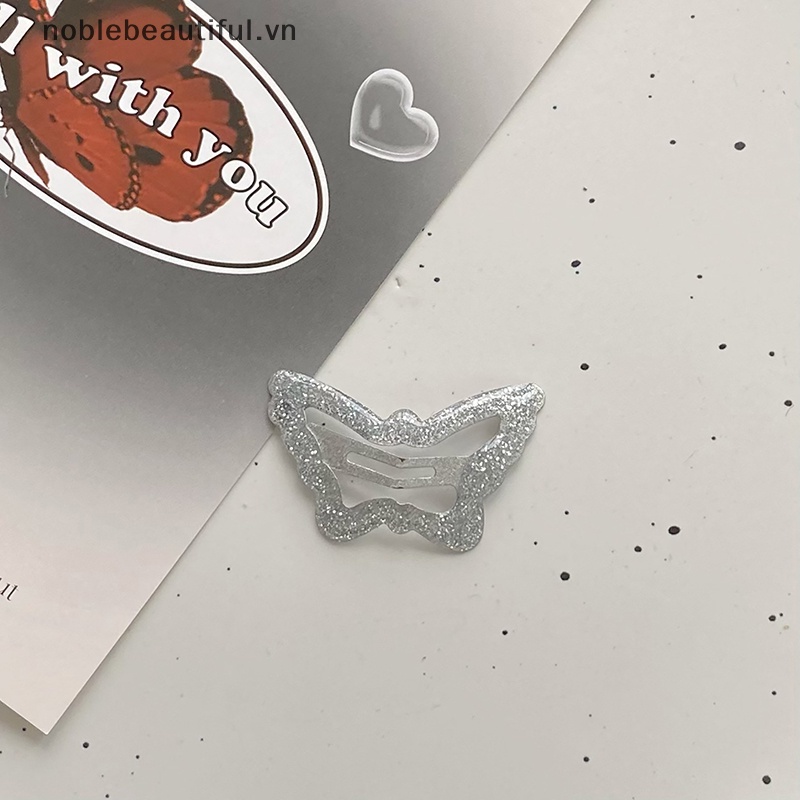 Bộ 2 Kẹp Tóc Kim Loại Hình Bướm Màu Bạc Dễ Thương Cho Nữ