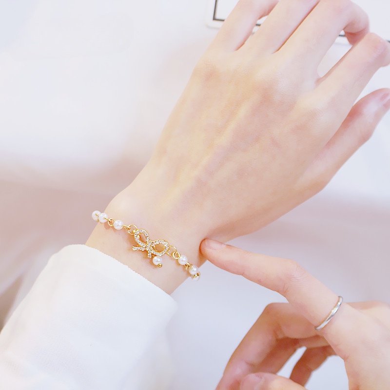 Vòng Tay Hình Nơ Đính Ngọc Trai Lấp Lánh Thời Trang Hàn Quốc Cho Nữ