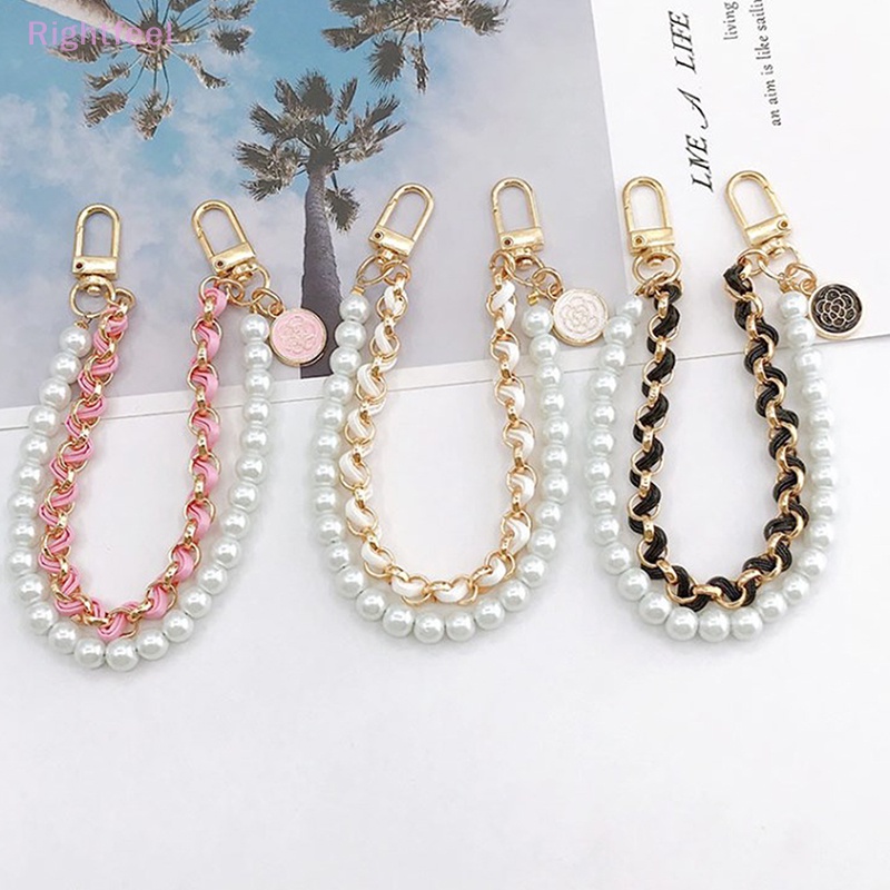 Dây Đeo Tay Bằng Da Đính Ngọc Trai Chống Thất Lạc Cho Điện Thoại Mới