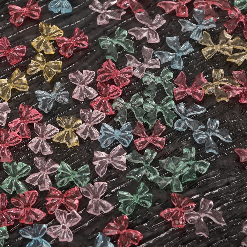 Set 50 Miếng Dán Móng Tay 3D Trong Suốt Hình Nơ Ruy Băng Thắt Nơ Bằng Nhựa Lấp Lánh DIY