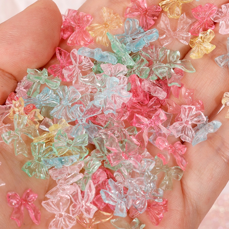 Set 50 Miếng Dán Móng Tay 3D Trong Suốt Hình Nơ Ruy Băng Thắt Nơ Bằng Nhựa Lấp Lánh DIY