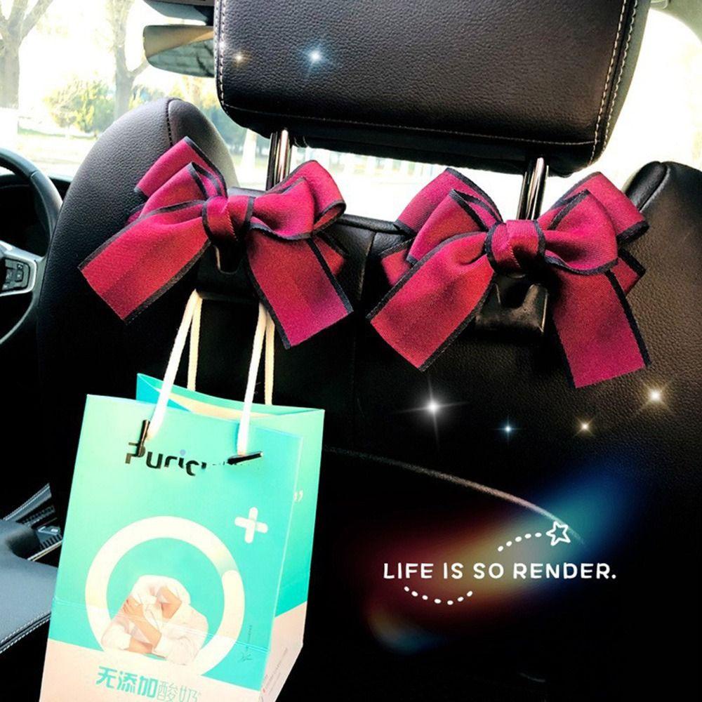 Móc Treo Đồ Gắn Lưng Ghế Xe Hơi Hình Nơ Bằng Nhựa Đa Năng Tiện Dụng