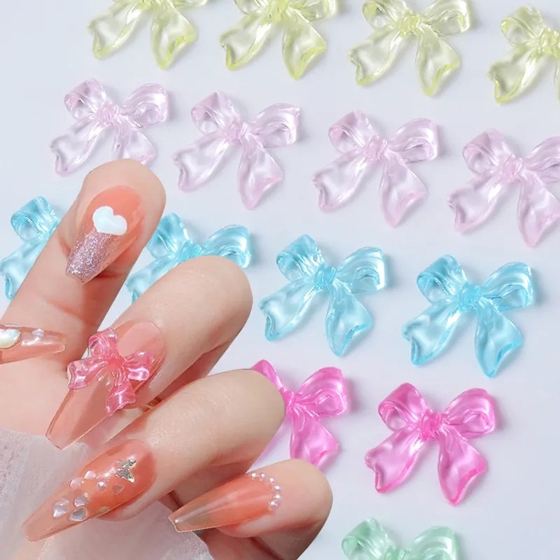 Set 50 Miếng Dán Móng Tay 3D Trong Suốt Hình Nơ Ruy Băng Thắt Nơ Bằng Nhựa Lấp Lánh DIY