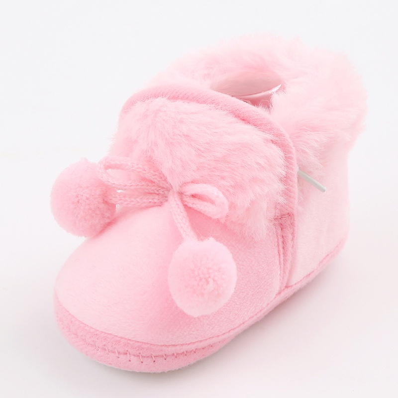 Baby cute boots sơ sinh nơ buộc tóc bóng trang trí giày bông trẻ mới biết đi dễ thương đáy mềm giày đi bộ giày đi tuyết