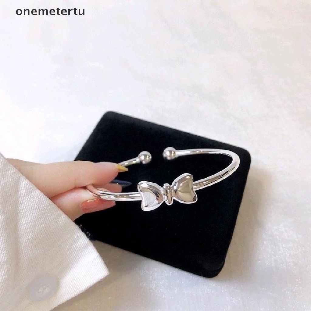 Vòng Đeo Tay Dạng Hở Hình Nơ Màu Bạc Điều Chỉnh Được Thời Trang Dành Cho Nữ