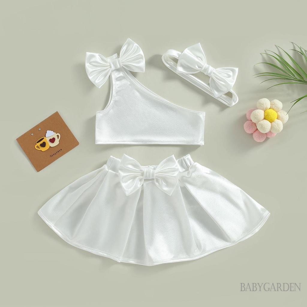 Set Đồ Mùa Hè Gồm Áo Ba Lỗ Đính Nơ + Chân Váy Chữ A + Băng Cài Đầu Cho Bé Gái 6 Tháng - 4 Tuổi