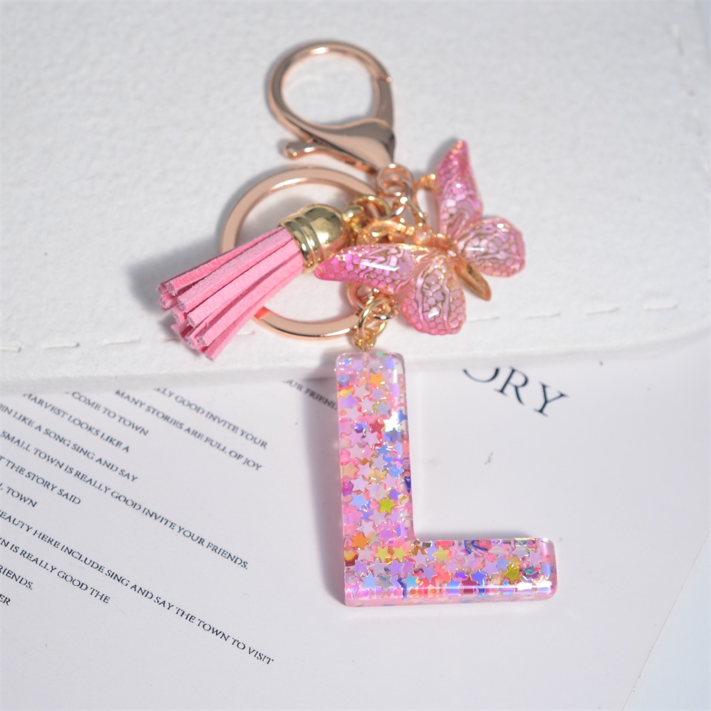 Móc Khóa 26 Chữ Tua Rua Bằng Nhựa Màu Hồng Thời Trang Cho Nữ