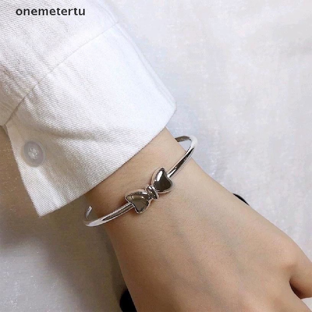 Vòng Đeo Tay Dạng Hở Hình Nơ Màu Bạc Điều Chỉnh Được Thời Trang Dành Cho Nữ