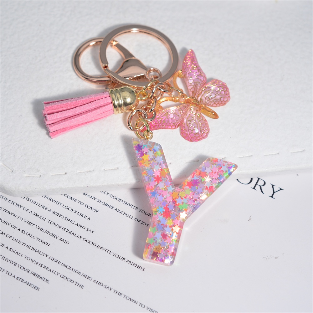 Móc Khóa 26 Chữ Tua Rua Bằng Nhựa Màu Hồng Thời Trang Cho Nữ