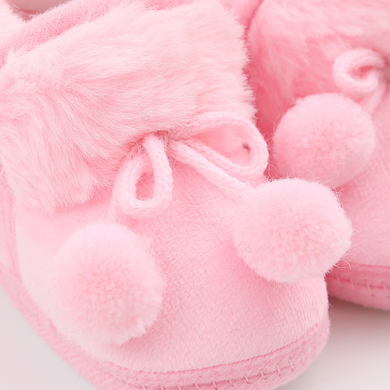 Baby cute boots sơ sinh nơ buộc tóc bóng trang trí giày bông trẻ mới biết đi dễ thương đáy mềm giày đi bộ giày đi tuyết