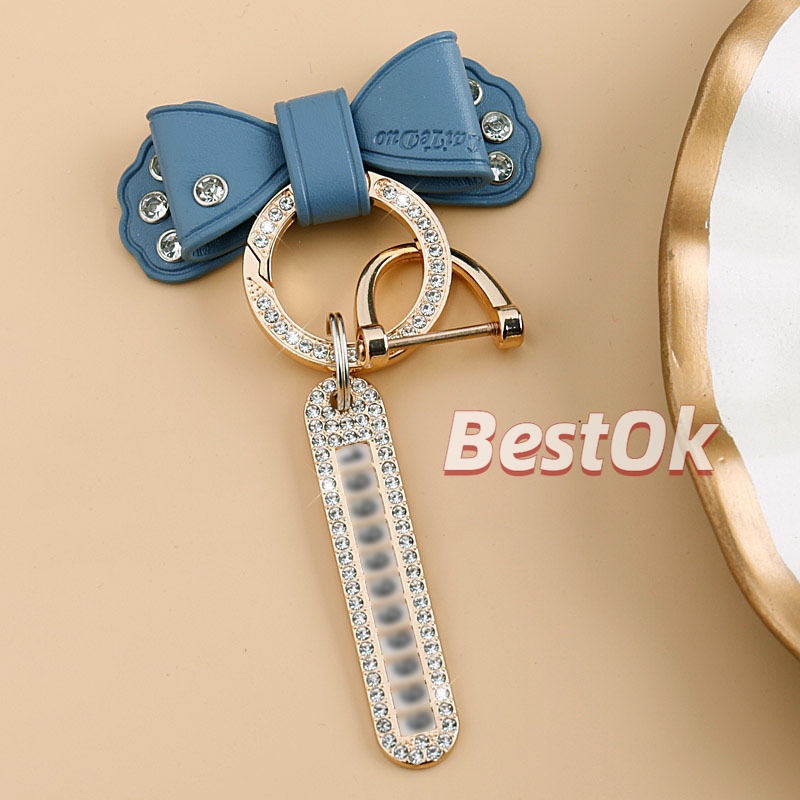 Móc Khóa Da Đính Đá Kim Loại Màu Vàng Hình Nơ Dễ Thương Có Biển Số Cho Nam Và Nữ