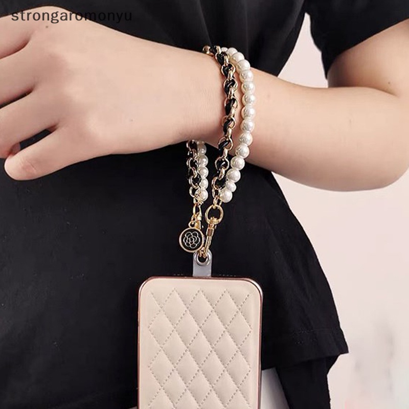 Dây Đeo Tay Bằng Da Đính Ngọc Trai Chống Thất Lạc Cho Điện Thoại