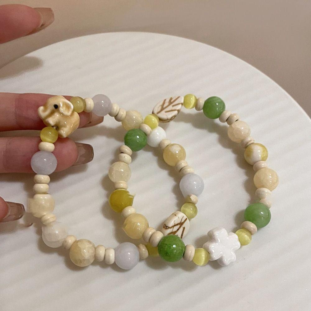 Vòng Tay Chuỗi Hạt Gốm Sứ Họa Tiết Hoa / Voi / Mắt Mèo Phong Cách Hàn Quốc Thời Trang