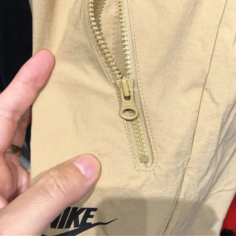 Quần chạy bộ Nike 100% Chính Hãng Dáng Rộng Phối Túi Có Khóa Kéo Thời Trang Dành Cho Nam Giới