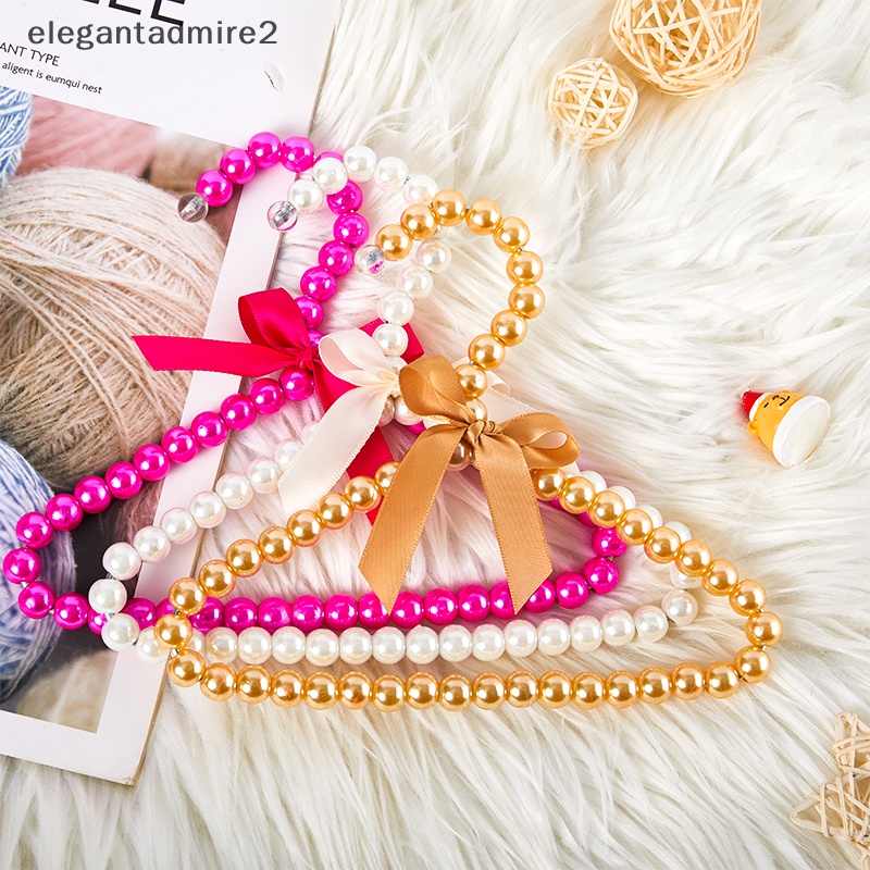 1 Móc Treo Quần Áo Bằng Nhựa Đính Nơ Và Ngọc Trai Dễ Thương Kích Thước 20cm Cho Thú Cưng