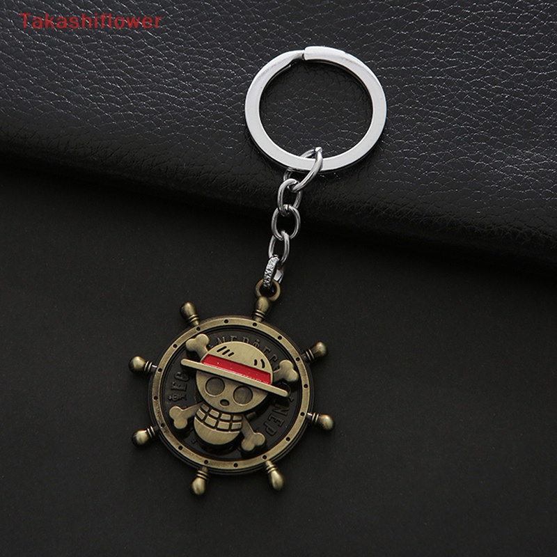 Móc Khóa Kim Loại Hình Đầu Lâu / Bánh Lái / Nón Xoay Được Mẫu One Piece