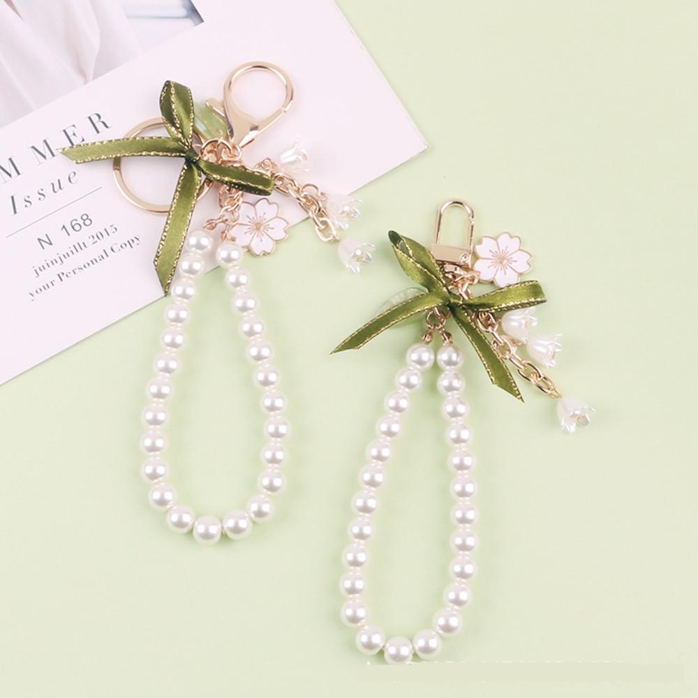 Ốp Điện Thoại Hình Hoa Lily Đính Ngọc Trai Kèm Móc Khóa Độc Đáo Trang Trí Túi Xách