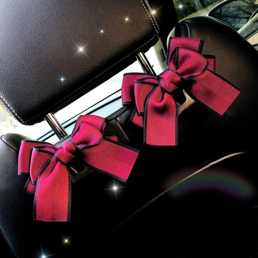 Móc Treo Đồ Gắn Lưng Ghế Xe Hơi Hình Nơ Bằng Nhựa Đa Năng Tiện Dụng